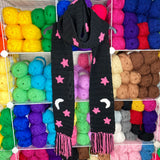 Chunky Celestial Scarf - Black crochet scarf with white crescent moon & bubblegum pink stars pattern with white, black and bubblegum pink tassels by VelvetVolcano