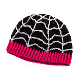 Black fitted crochet beanie with light grey spider web / cobweb design and cerise pink ribbed brim by VelvetVolcano