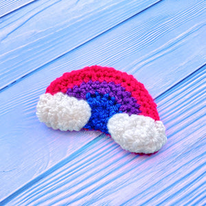 Bisexual Pride Flag inspired crochet rainbow hair clip with white clouds on the ends of the rainbow. Bisexual Rainbow Cloud Hair Clip by VelvetVolcano