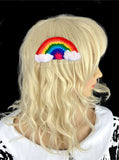 Crochet rainbow hair clip with white clouds at both ends of the rainbow - Bright Rainbow Cloud Hair Clip by VelvetVolcano