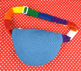 Dolphin Blue Crochet Bum Bag / Fanny Pack / Waist Bag / Crossbody Bag with Bright Rainbow Striped Strap, and a Bright Rainbow and Cloud Design by VelvetVolcano