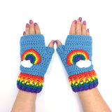 Chunky Bright Rainbow Cloud Crochet Fingerless Gloves in Dolphin Blue with rainbow striped cuffs and rainbow and cloud motif by VelvetVolcano