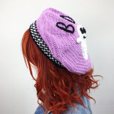 Lilac crochet beret with white smiley ghost applique and black BOO! lettering (BOO! Ghost Beret - Custom Colour Crochet Pastel Goth Hat by VelvetVolcano)