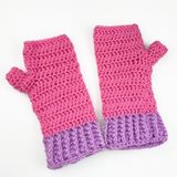 Bubblegum Pink crochet hand warmers with white polka dot pattern, lilac cuffs and a turquoise bow in the centre of the cuff. Polka Dot Bow Fingerless Gloves (Custom Colour) by VelvetVolcano