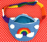 Dolphin Blue Crochet Bum Bag / Fanny Pack / Waist Bag / Crossbody Bag with Bright Rainbow Striped Strap, and a Bright Rainbow and Cloud Design by VelvetVolcano