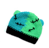 The back of a Neon Green, Turquoise and Black FrankenKitty Beanie by VelvetVolcano