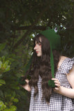 Kara wearing the Frog Earflap Beanie in Forest