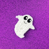 Crochet white ghost brooch with cute smiling face and rhinestone eye glints, with a white felt backing and silver plated brooch pin. Ghost Brooch by VelvetVolcano