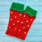 Rose red pink crochet leg warmers designed to look like strawberries with emerald green top cuffs that feature little green leaves and silver rhinestone seeds by VelvetVolcano