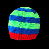 A royal blue and neon green striped crochet beanie with red ribbed brim by VelvetVolcano