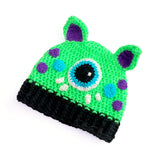 A neon green, violet, turquoise, white and black cat ear Cyclops Kitty Beanie by VelvetVolcano