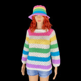 A mannequin is wearing a pastel rainbow striped crochet bucket hat and a cream and pastel rainbow striped crochet jumper.