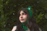 Kara wearing the Frog Headband in Emerald Green.