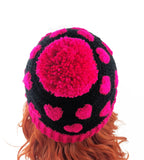Hot Pink & Black Heart Print Pom Pom Acrylic Crochet Beanie by VelvetVolcano