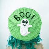 Pastel green crochet beret with white smiley ghost applique and black BOO! lettering (BOO! Ghost Beret - Custom Colour Crochet Pastel Goth Hat by VelvetVolcano)