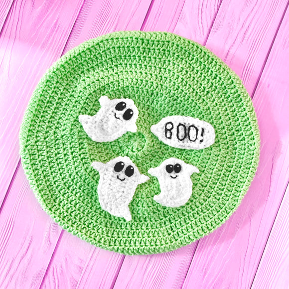 Pastel Green crochet beret with cute ghost appliques and a speech bubble that says 