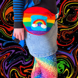 Bright rainbow striped crochet fanny pack with turquoise pocket and rainbow cloud detail. Bright Rainbow Stripe Cloud Pocket Bum Bag by VelvetVolcano
