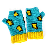 Turquoise crochet hand warmers with black and yellow leopard print design and yellow cuffs. Leopard Fingerless Gloves (Custom Colour) by VelvetVolcano