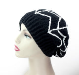 Black crochet slouchy beanie with white spider web / cobweb detail by VelvetVolcano