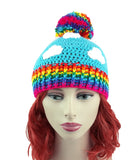 Turquoise crochet beanie with white cloud print, rainbow pom pom and rainbow rib section at the bottom of the hat. Bright Rainbow Cloud Pom Pom Beanie by VelvetVolcano