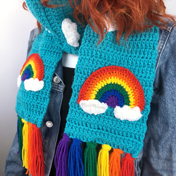 Turquoise chunky crochet scarf with rainbow tassels, rainbow & cloud motif and white cloud repeating pattern. Chunky Bright Rainbow Cloud Scarf by VelvetVolcano