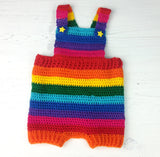 Brightly Coloured Rainbow Striped Crochet Baby Dungarees with Yellow Star Button Fastenings made from Acrylic Yarn in Red, Orange, Yellow, Green, Turquoise, Royal Blue, Purple and Pink.