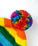 Bright rainbow striped crochet bobble hat with multicoloured pom pom. Bright Rainbow Striped Pom Pom Beanie by VelvetVolcano