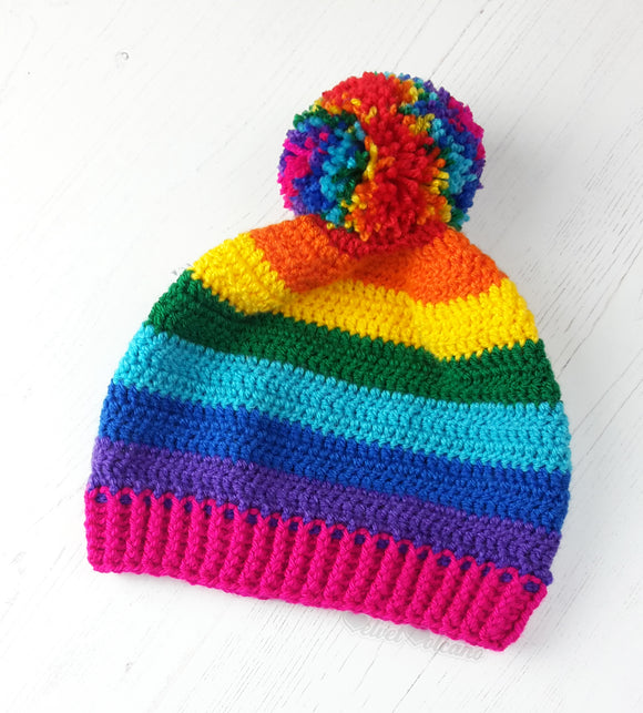 Bright rainbow striped crochet bobble hat with multicoloured pom pom. Bright Rainbow Striped Pom Pom Beanie by VelvetVolcano