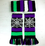 Purple, neon green, black and white striped crochet scarf with white cobweb panels and multicoloured tassels. Spider Web Stripe Scarf (Custom Colour) by VelvetVolcano