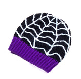Black crochet slouchy beanie with white spider web detail and violet ribbed brim by VelvetVolcano