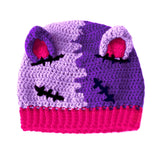 Half lilac, half violet crochet beanie with cat ears (which are hot pink inside) and a hot pink ribbed brim, designed to look like a Frankenstein's Monster Kitty. Custom Colour FrankenKitty Beanie by VelvetVolcano